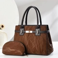 Detail of dark brown vintage tote bag with marble texture, gold lock and matching pouch - Coffee