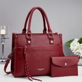 Red pebbled leather tote and wallet set with metal studs and tassel details - Red