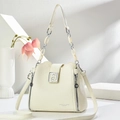 Detail of cream white leather bag with lychee texture and silver geometric buckle - White
