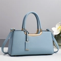 Elegant light blue faux leather handbag with gold U-shaped hardware and dual straps - Blue
