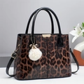 Glossy leopard print handbag for women with pearl pompom charm and adjustable strap - Coffee