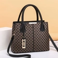 Retro geometric printed tote bag with black leather handles and golden hardware accents - Black
