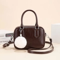 Dark brown shiny faux leather bowling bag with white pompom charm and silver hardware - Coffee