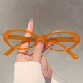 Stylish oval blue light blocking glasses with transparent orange resin frames for women - Orange