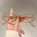 Oval transparent amber blue light blocking glasses with a minimalist resin frame - Transparent Tea