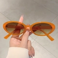 Lunettes de soleil ovales orange translucide avec verres dégradés marron style tendance - Monture Orange Thé Dégradé