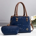 Detailed macro view of blue snakeskin pattern Boston bag with circular gold K letter logo - Blue
