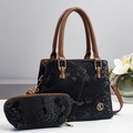 Chic black snakeskin Boston bag set with brown handles and golden metal K logo - Black