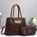 Detailed view of brown textured leather handbag set with matching pouch and gold accents - Coffee