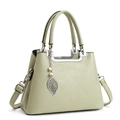 Minimalist soft leather tote bag in light mint green with pearl leaf pendant detail - Green