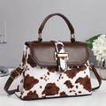 Chic cow print handbag with brown leather flap and gold metal buckle for women - Coffee