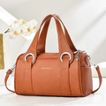 Litchi texture leather pillow handbag in bright orange brown with silver hardware - Khaki/Earth Yellow