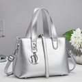 Silver metallic tote bag with handles and crossbody strap on a minimalist indoor display - Silver (A96254)