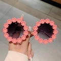 Close-up of pink daisy flower frame sunglasses with dark gradient lenses and clear temples - Pink Floral