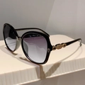Detail of oversized sunglasses with gradient lenses and gold chain metal accents - Black Frame Double Gray Lens