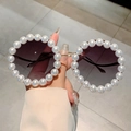 Detail of round sunglasses featuring hand-set white pearls and gold metal frames - Gold Frame Gradient Grey Lens