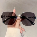 Frameless oversized black sunglasses with unique metal chain temples and dark grey lenses - Black Gray