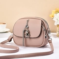Chic pink leather shoulder bag with multi-zip compartments and silver bear pendant - Pink