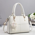 White faux crocodile skin handbag for women with gold hardware and plush ball charm - White