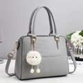Chic grey contrast texture handbag with crocodile pattern, top handles and plush charm - Gray