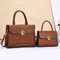 Detail of brown lychee texture leather handbag set with vintage metal clasp and pleat design - Khaki/Earth Yellow