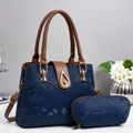 Elegant navy blue snakeskin tote bag set with brown leather straps and gold hardware lock - Blue