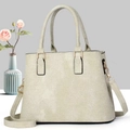 Champagne gold textured leather tote bag with dual handles and adjustable shoulder strap - Light Green