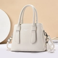 Detail of white lychee pattern leather handbag with double handles and shoulder strap - Off White