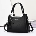 Elegant black lychee leather handbag for women with silver hardware and star charm decor - Black