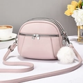 Pink lychee grain leather crossbody bag with triple zippers and white fur pompom charm - Pink