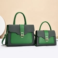 Detail of emerald green and gray patchwork handbag set with golden oval swivel lock - Two-Piece Set / Green