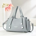 Detail of light blue lychee pattern leather bag with silver hardware and shoulder strap - Sky Blue