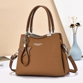 Brown twill tote bag with leather handles and star charm on a minimalist background - Khaki/Earth Yellow