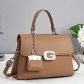 Detail of a brown leather bag with a crystal G buckle and woven texture finish - Khaki