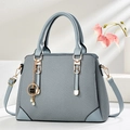 Light blue woven texture tote bag with gold hardware and pearl clover charm - Blue (Weave Pattern)