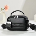 Detail of black lychee grain leather bag with wide striped strap and double zippers - Black