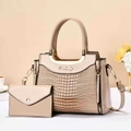 Detail of elegant beige crocodile-patterned handbag set with gold U-shaped metal handles - Khaki