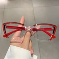 Detail view of red and black cat eye frames with clear lower rim and CE specification marks - Top Red Black Bottom Clear Frame Red Legs