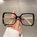 Detail shot of vintage square frames with tortoiseshell pattern and beige interior design - Leopard Khaki Edge
