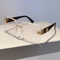 Close-up of golden rose hinge detail and high-gloss temples on rimless sunglasses - Black Legs Transparent Lens