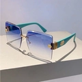 Detail of teal matte temple and gold rose ornament on rimless gradient sunglasses - Green Temple Gradient Blue Lens