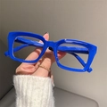 Close-up of chunky royal blue square glasses frames with high-gloss finish details - Blue Frame
