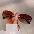 Lunettes de soleil ovales sans monture, verres dégradés marron et monture dorée - Thé Dégradé