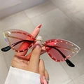 Close-up of pink gradient cat-eye sunglasses with rhinestone edges and gold frame - Gradient Pink
