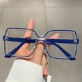 Retro square glasses with navy blue and clear dual-tone frame held by hand - Transparent Blue Edge
