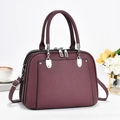 Deep burgundy pebbled leather tote bag with silver hardware and adjustable shoulder strap - Purple