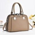 Detail of khaki leather tote with multi-compartment zip design and silver hardware - Khaki