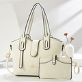 Cream white tote bag set with heart text and matching pouch on minimalist white pedestal - Off White