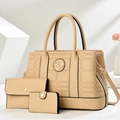 Close-up of beige three-piece bag set with textured leather and gold metal details - Khaki