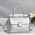 Silver pebbled leather trapezoid handbag with top handle and adjustable shoulder strap - Silver